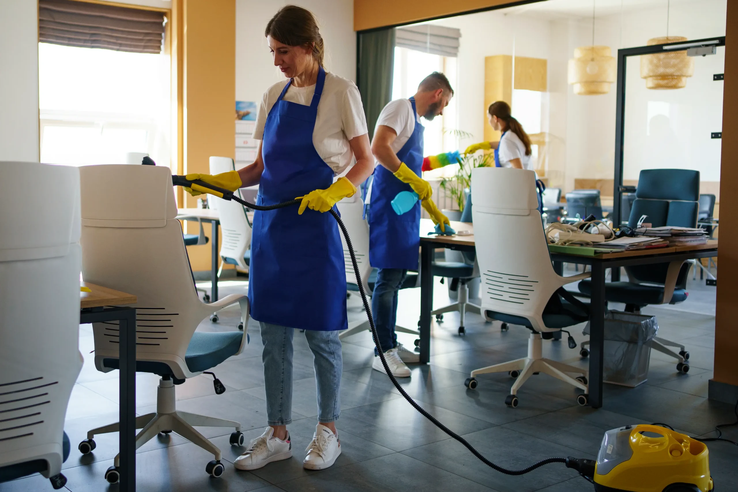 professional-cleaning-service-person-using-vacuum-cleaner-office-scaled.